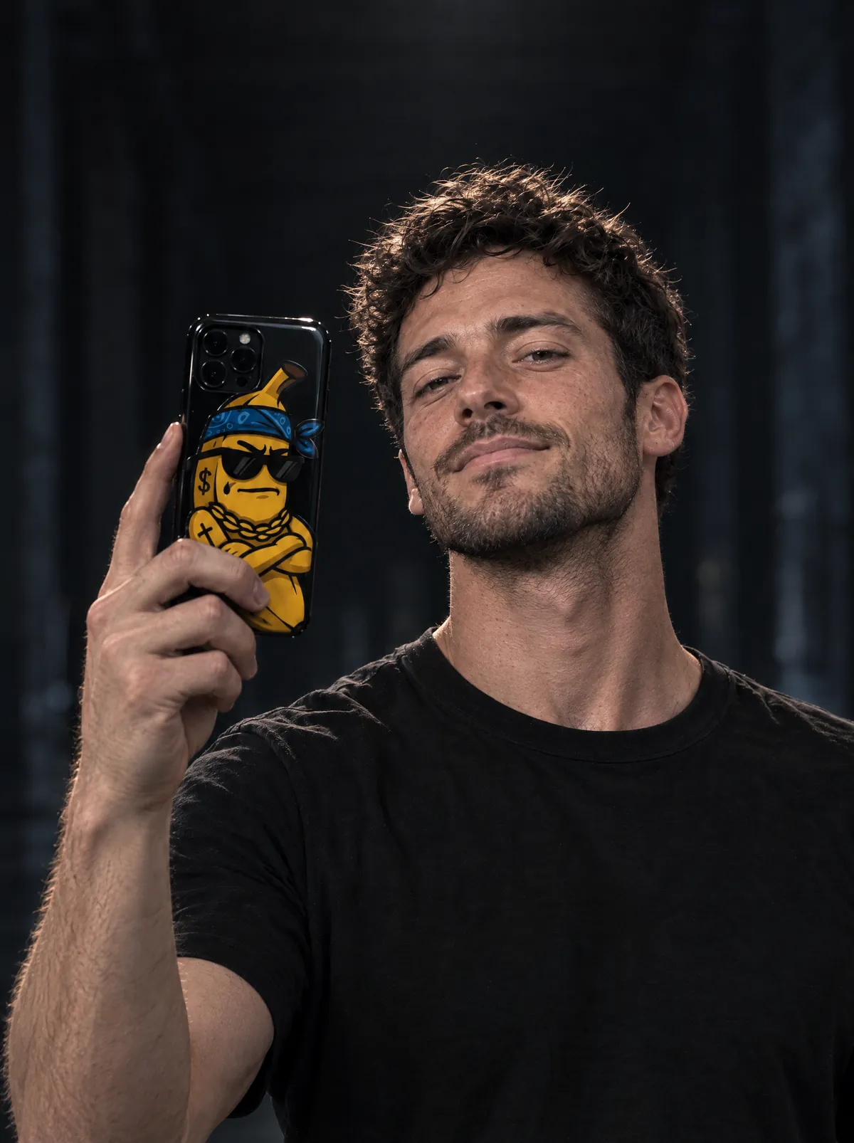 The same man taking a selfie with a phone case printed with a cool banana in sunglasses